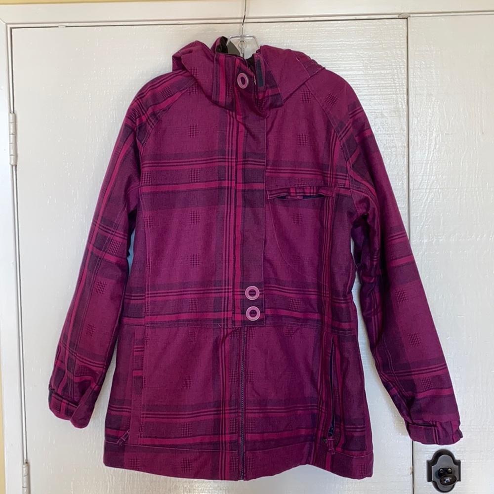 Snowboard and ski jacket in purple/pink plaid. Size women’s large by PWDR Room.